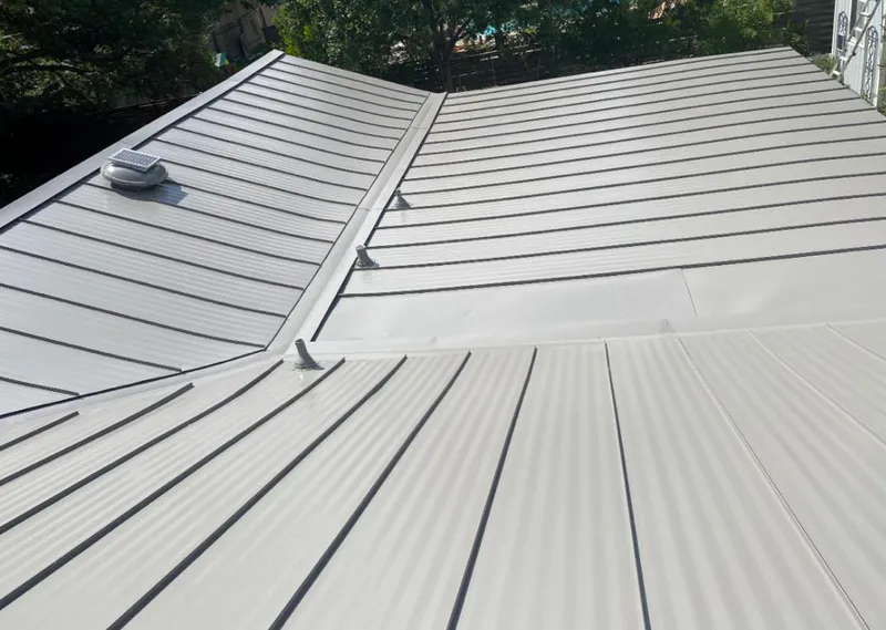 Solar attic fan installed on a metal roof for Roof Ventilation in West Hattiesburg